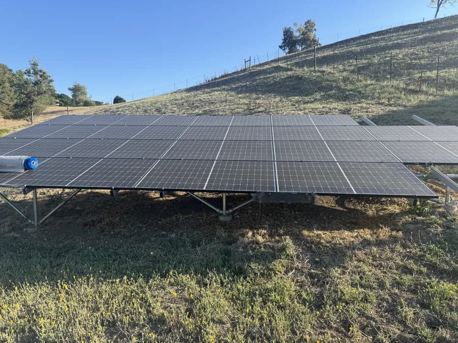 Ground mounted solar array coated in dust before cleaning